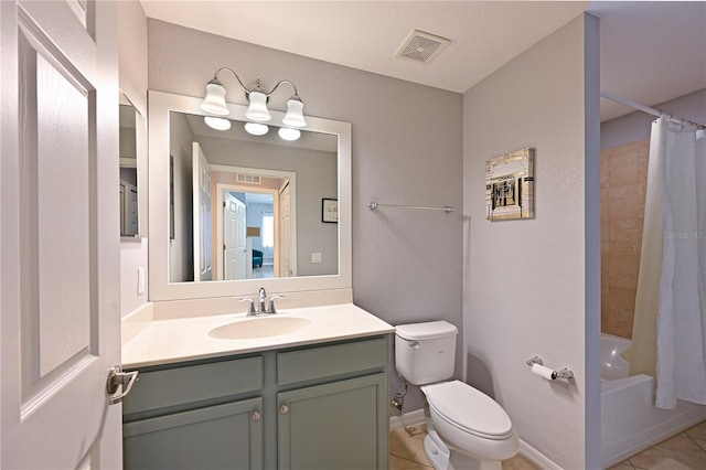 bathroom with toilet, tile patterned floors, vanity, shower / tub combo, and baseboards