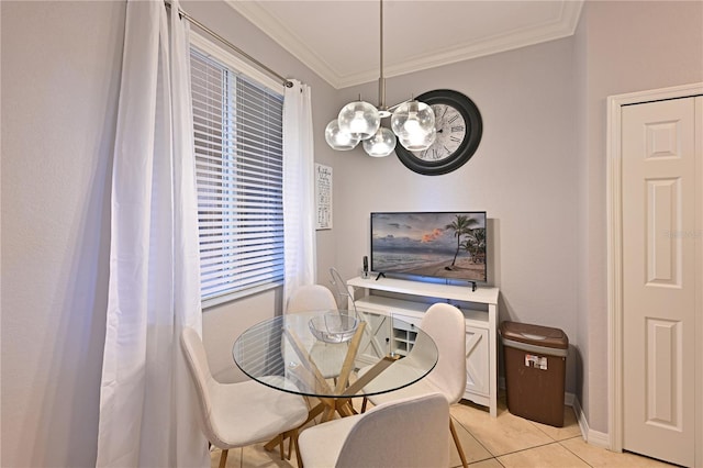 dining room featuring crown molding, light tile patterned floors, a chandelier, and baseboards