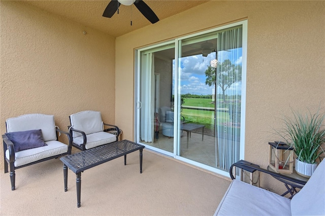 balcony featuring ceiling fan