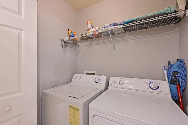 laundry room with independent washer and dryer