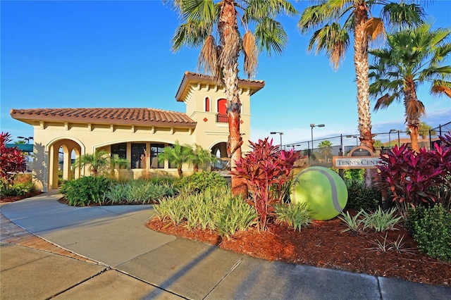 view of building exterior with fence