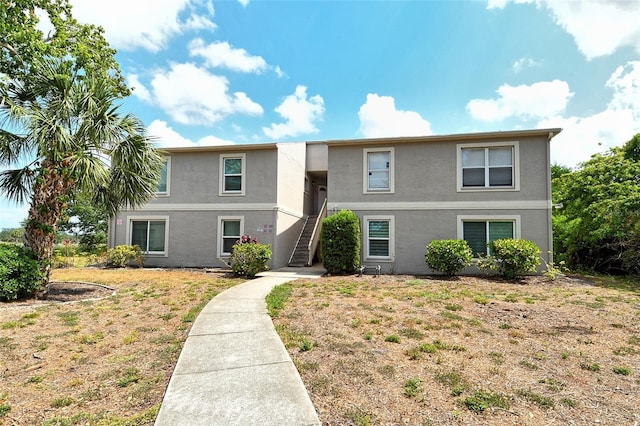 383 Bobby Jones Rd Unit 383, Sarasota, FL 34232 - view of front facade featuring stairs and stucco siding