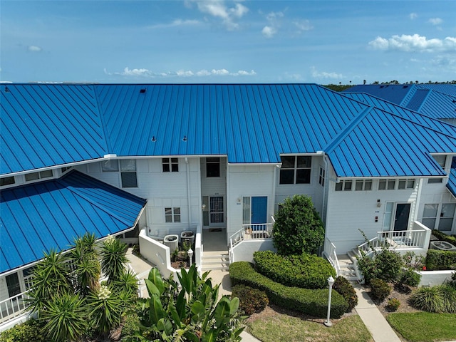 view of front of property with a standing seam roof and metal roof