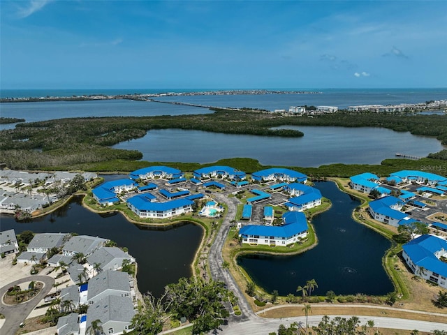 aerial perspective of suburban area with a nearby body of water