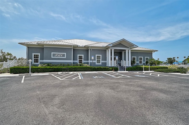 view of property featuring uncovered parking