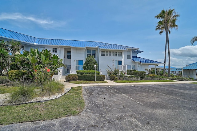 view of property with uncovered parking