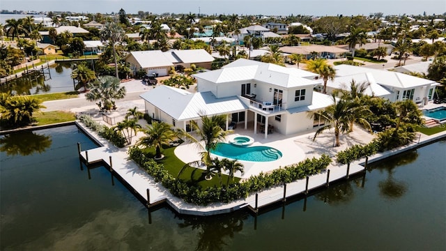 603 Emerald Ln, Holmes Beach, FL 34217 - aerial perspective of suburban area with a pool area and a large body of water