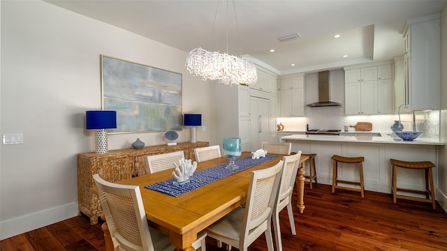603 Emerald Ln, Holmes Beach, FL 34217 - dining room featuring a chandelier, dark wood-style floors, baseboards, and recessed lighting