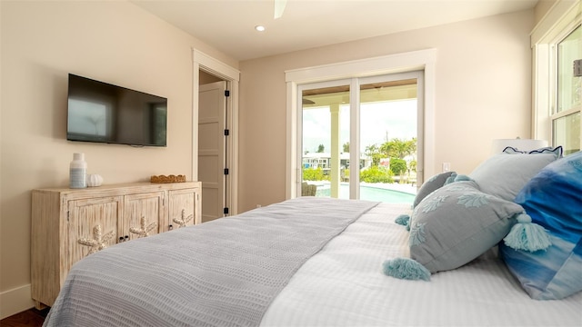 603 Emerald Ln, Holmes Beach, FL 34217 - bedroom with access to outside, multiple windows, and recessed lighting
