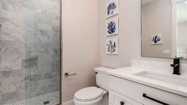 603 Emerald Ln, Holmes Beach, FL 34217 - bathroom featuring toilet, a shower stall, and vanity