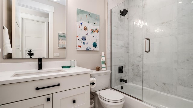 603 Emerald Ln, Holmes Beach, FL 34217 - bathroom featuring vanity, bath / shower combo with glass door, and toilet