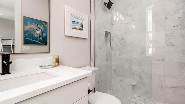 603 Emerald Ln, Holmes Beach, FL 34217 - bathroom featuring a marble finish shower, toilet, and vanity