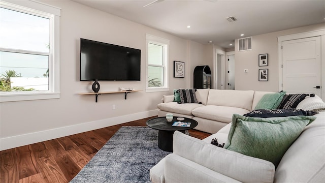 603 Emerald Ln, Holmes Beach, FL 34217 - living area featuring baseboards, wood finished floors, and recessed lighting