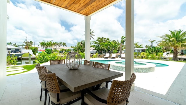 603 Emerald Ln, Holmes Beach, FL 34217 - view of patio featuring a pool with connected hot tub