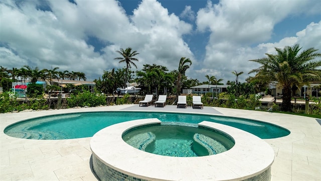 603 Emerald Ln, Holmes Beach, FL 34217 - view of swimming pool with a pool with connected hot tub