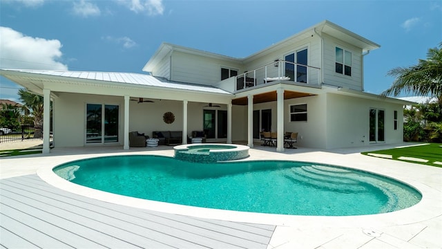 603 Emerald Ln, Holmes Beach, FL 34217 - rear view of property with an outdoor hangout area, a balcony, ceiling fan, and stucco siding