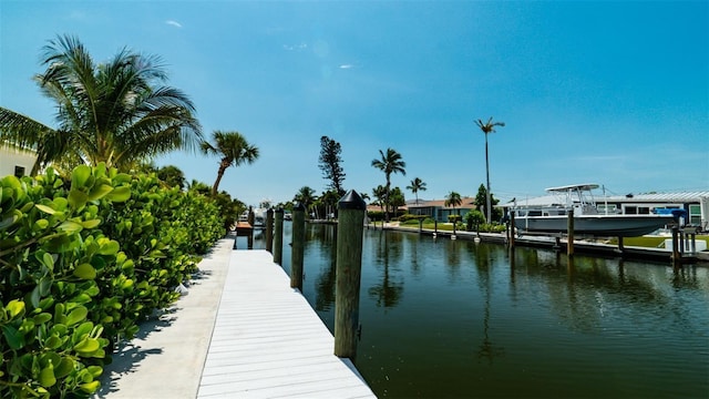 603 Emerald Ln, Holmes Beach, FL 34217 - dock featuring a water view