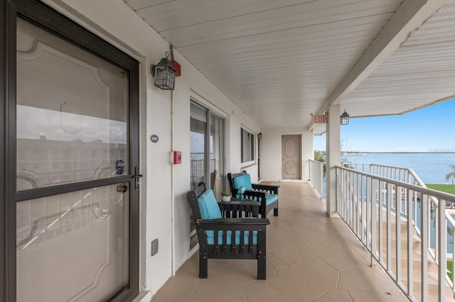 balcony featuring a water view