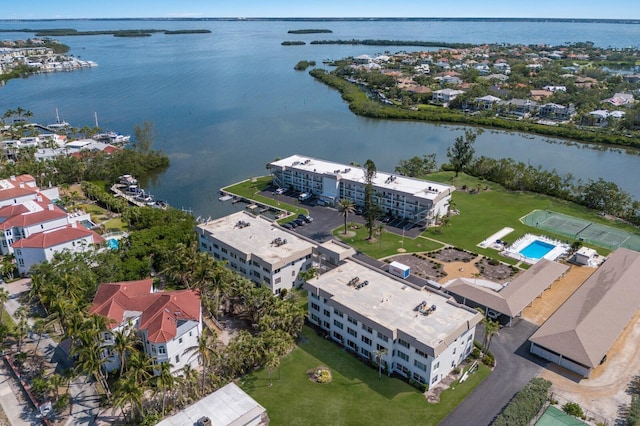 aerial view of a large body of water and apartment complex