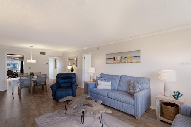 living area featuring crown molding