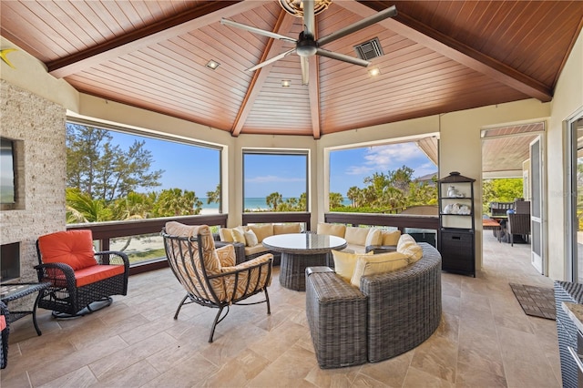 view of patio featuring an outdoor hangout area, a gazebo, a ceiling fan, and a water view