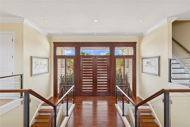 foyer entrance with stairway, hardwood / wood-style flooring, baseboards, ornamental molding, and recessed lighting