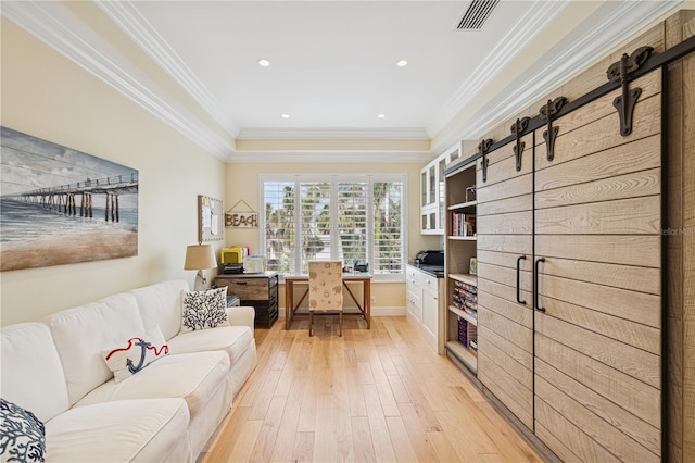 office space with light wood finished floors, ornamental molding, baseboards, and recessed lighting