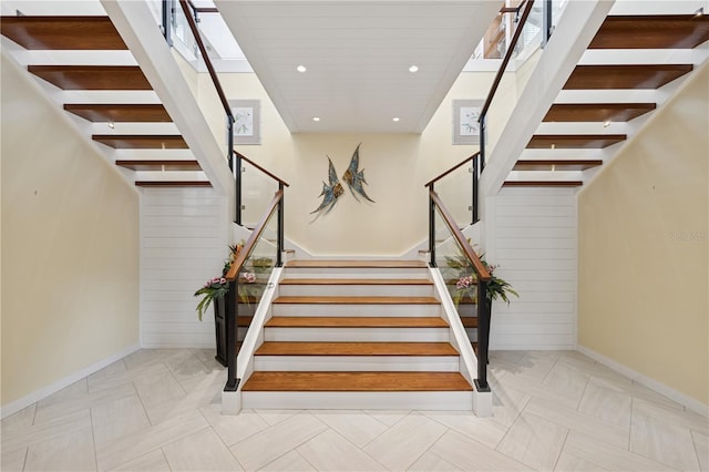 stairway featuring recessed lighting and baseboards