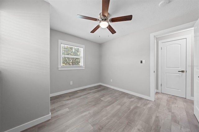 219 Vermont Ave, Saint Cloud, FL 34769 - unfurnished room featuring light wood-style floors, ceiling fan, and baseboards