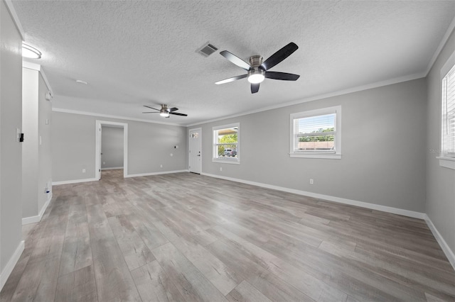 219 Vermont Ave, Saint Cloud, FL 34769 - unfurnished room featuring crown molding, ceiling fan, a textured ceiling, light wood finished floors, and baseboards