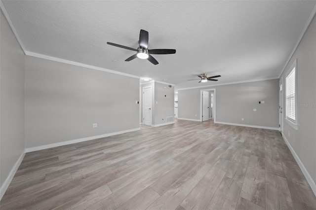 219 Vermont Ave, Saint Cloud, FL 34769 - unfurnished living room featuring a ceiling fan, light wood finished floors, ornamental molding, baseboards, and a textured ceiling