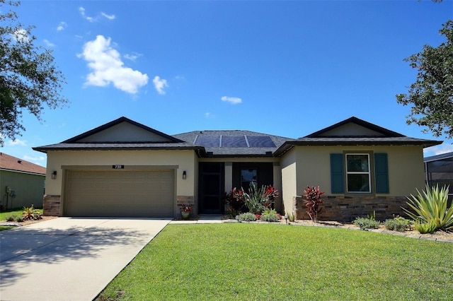 7311 64th St E, Palmetto, FL 34221 - single story home featuring a front lawn, stucco siding, a garage, and stone siding