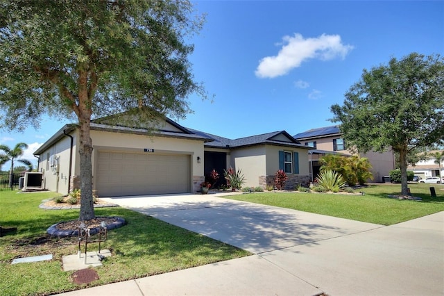 7311 64th St E, Palmetto, FL 34221 - ranch-style home with stucco siding, an attached garage, concrete driveway, and a front yard
