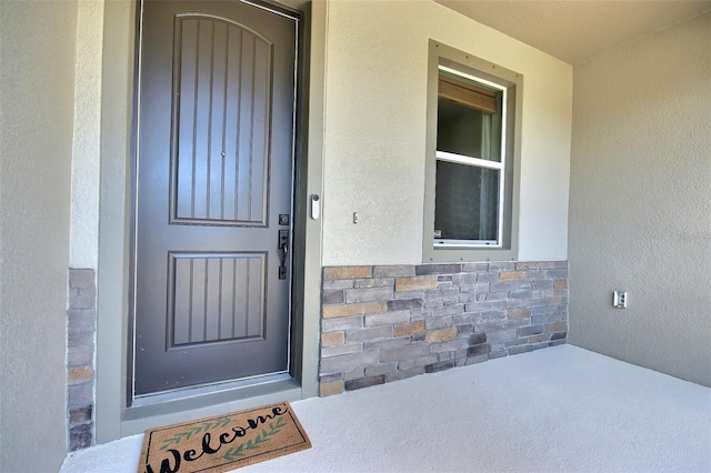 7311 64th St E, Palmetto, FL 34221 - property entrance with stone siding and stucco siding