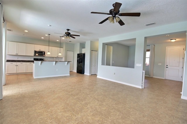 7311 64th St E, Palmetto, FL 34221 - unfurnished living room with ceiling fan, baseboards, and recessed lighting