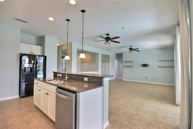 7311 64th St E, Palmetto, FL 34221 - kitchen with black fridge with ice dispenser, dishwasher, a sink, ceiling fan, and an island with sink