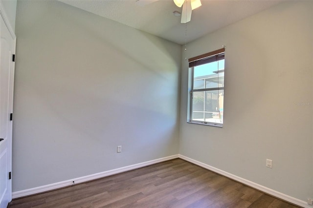 7311 64th St E, Palmetto, FL 34221 - empty room featuring dark wood-style flooring, baseboards, and ceiling fan