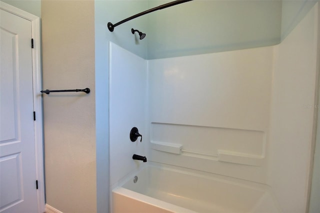 7311 64th St E, Palmetto, FL 34221 - bathroom featuring shower / bathtub combination and baseboards