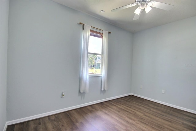 7311 64th St E, Palmetto, FL 34221 - empty room with dark wood finished floors, baseboards, and ceiling fan