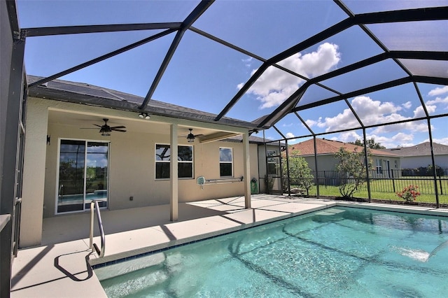 7311 64th St E, Palmetto, FL 34221 - view of swimming pool with a patio, ceiling fan, fence, and a lanai