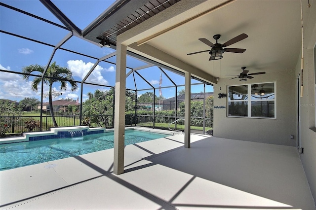 7311 64th St E, Palmetto, FL 34221 - swimming pool featuring a patio area, a ceiling fan, and glass enclosure