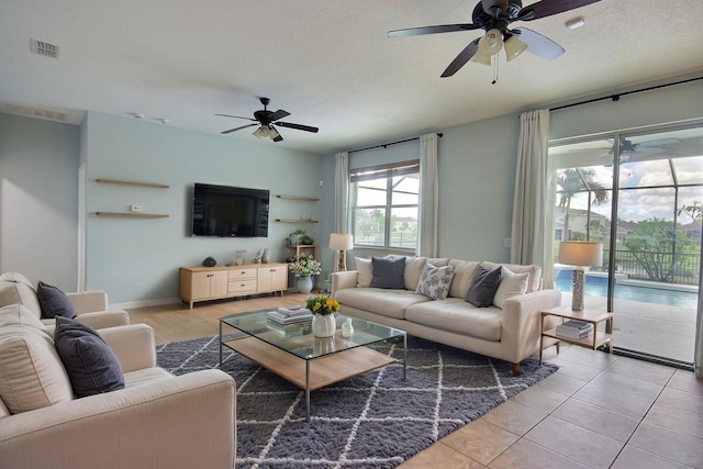 7311 64th St E, Palmetto, FL 34221 - living room featuring a ceiling fan
