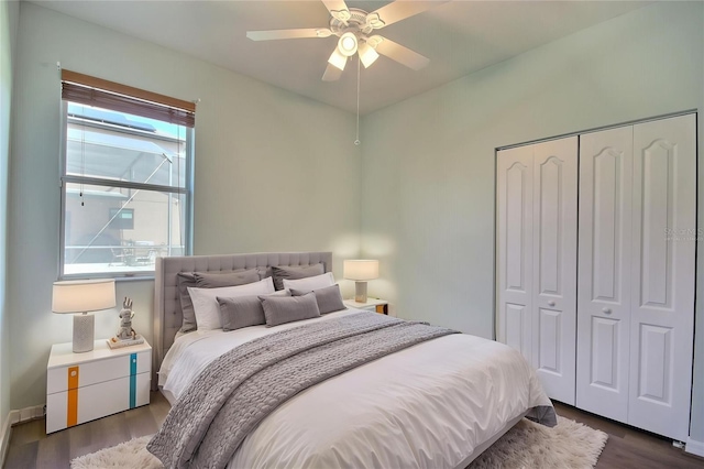 7311 64th St E, Palmetto, FL 34221 - bedroom with dark wood-type flooring, a closet, and a ceiling fan