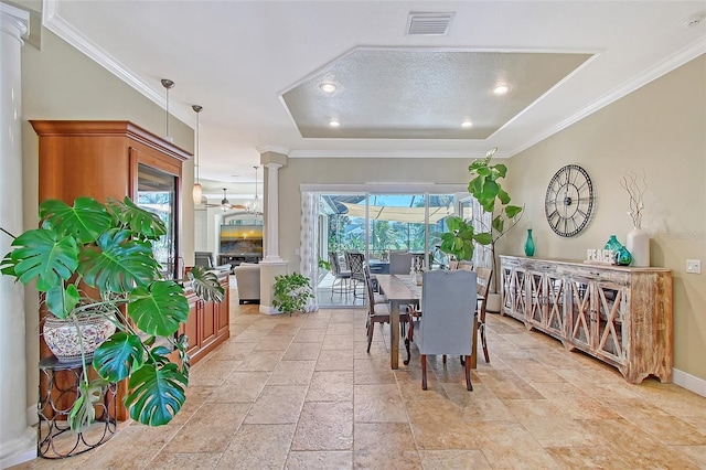 6539 Flycatcher Ln, Lakewood Ranch, FL 34202 - dining area featuring ornate columns, stone tile floors, ornamental molding, baseboards, and recessed lighting
