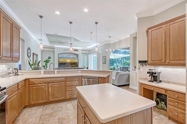 6539 Flycatcher Ln, Lakewood Ranch, FL 34202 - kitchen with open floor plan, a sink, appliances with stainless steel finishes, backsplash, and ornamental molding