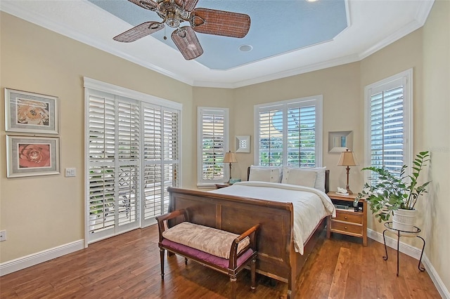 6539 Flycatcher Ln, Lakewood Ranch, FL 34202 - bedroom with crown molding, access to exterior, wood-type flooring, baseboards, and a ceiling fan