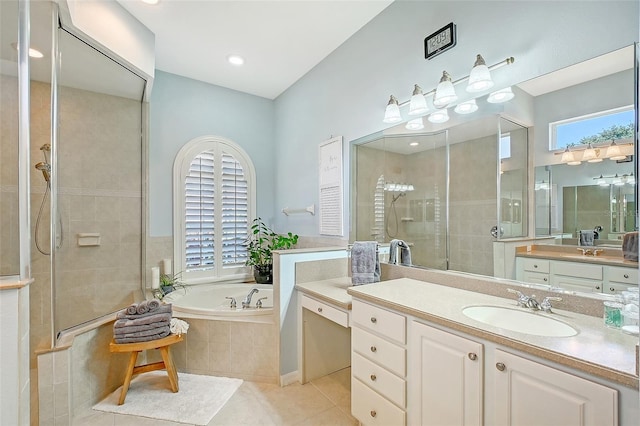 6539 Flycatcher Ln, Lakewood Ranch, FL 34202 - bathroom featuring tile patterned floors, a tile shower, a garden tub, and vanity