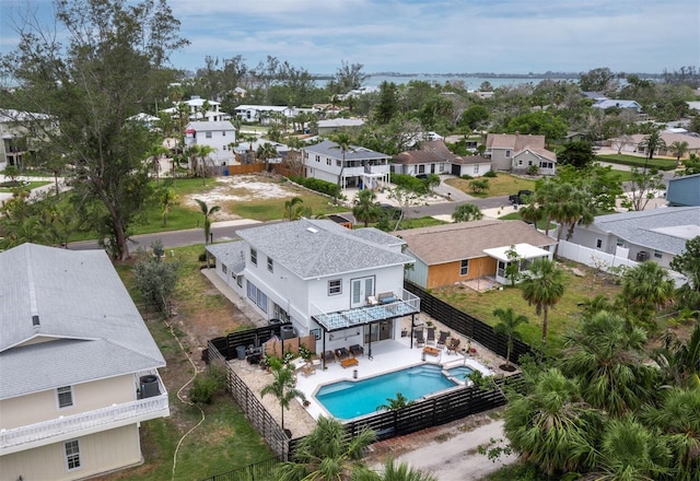 aerial view of residential area with a pool