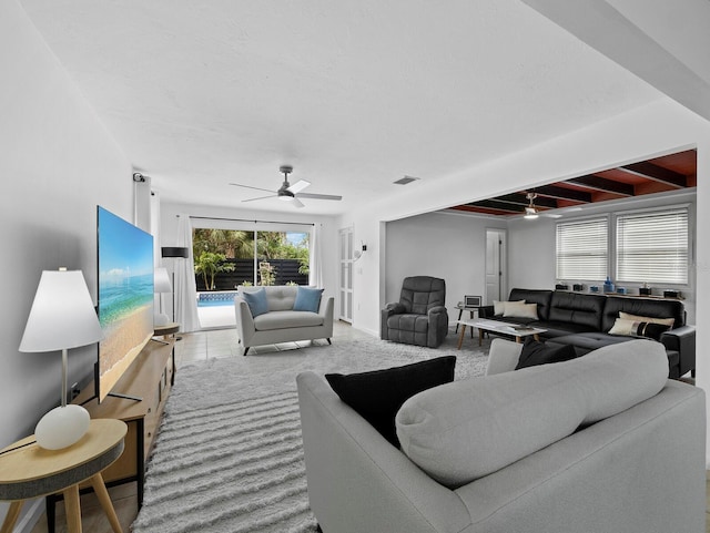 living area featuring a ceiling fan