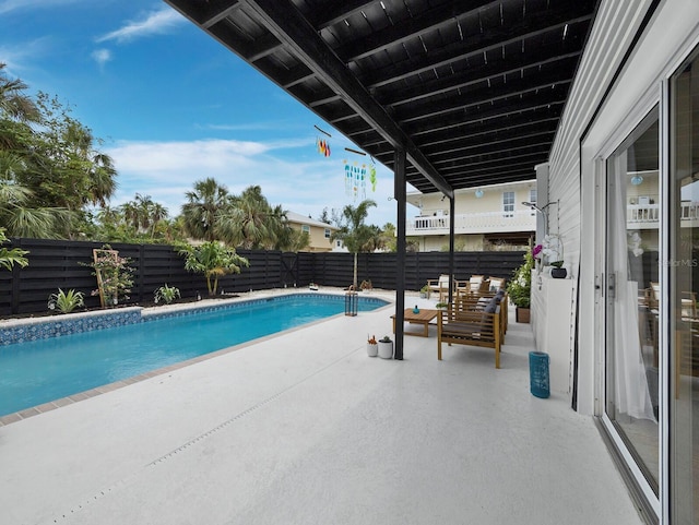 view of pool with a patio and a fenced backyard